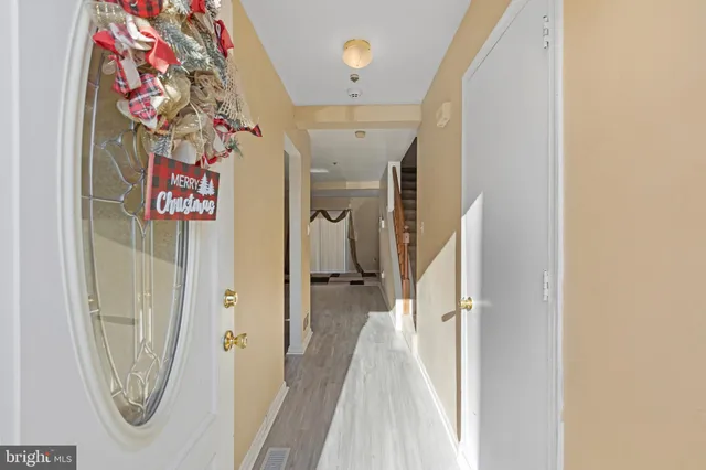 a view of a hallway with a flower pot