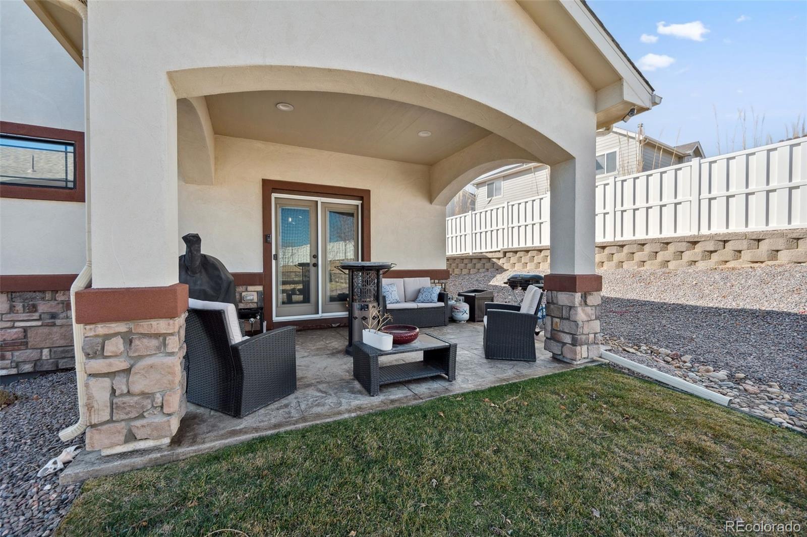 156 Chapel Hill Circle Brighton, CO 80601 - Photo 16 of 48 a living room with furniture and a large window