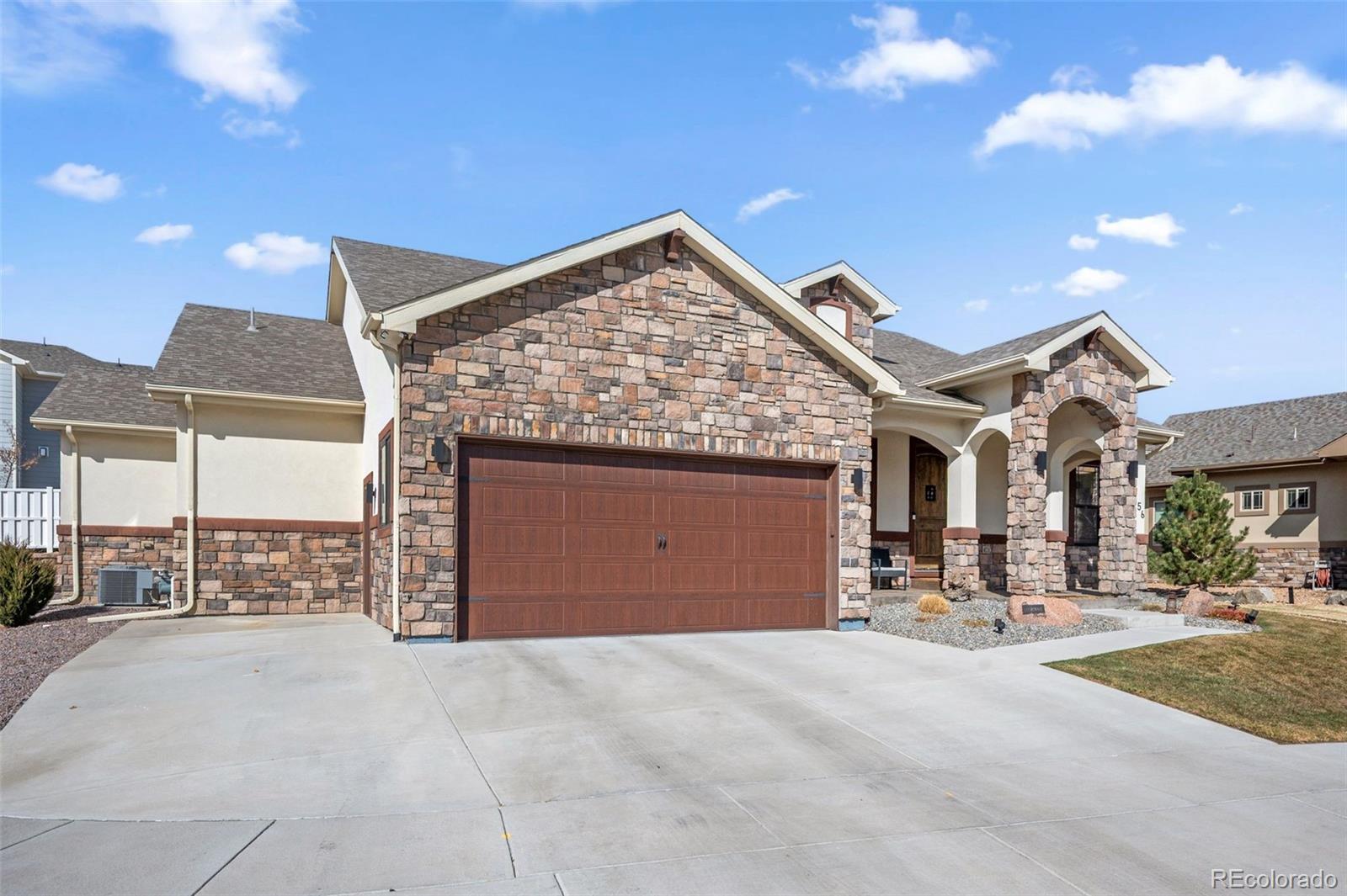 156 Chapel Hill Circle Brighton, CO 80601 - Photo 2 of 48 a view of a building with a outdoor space