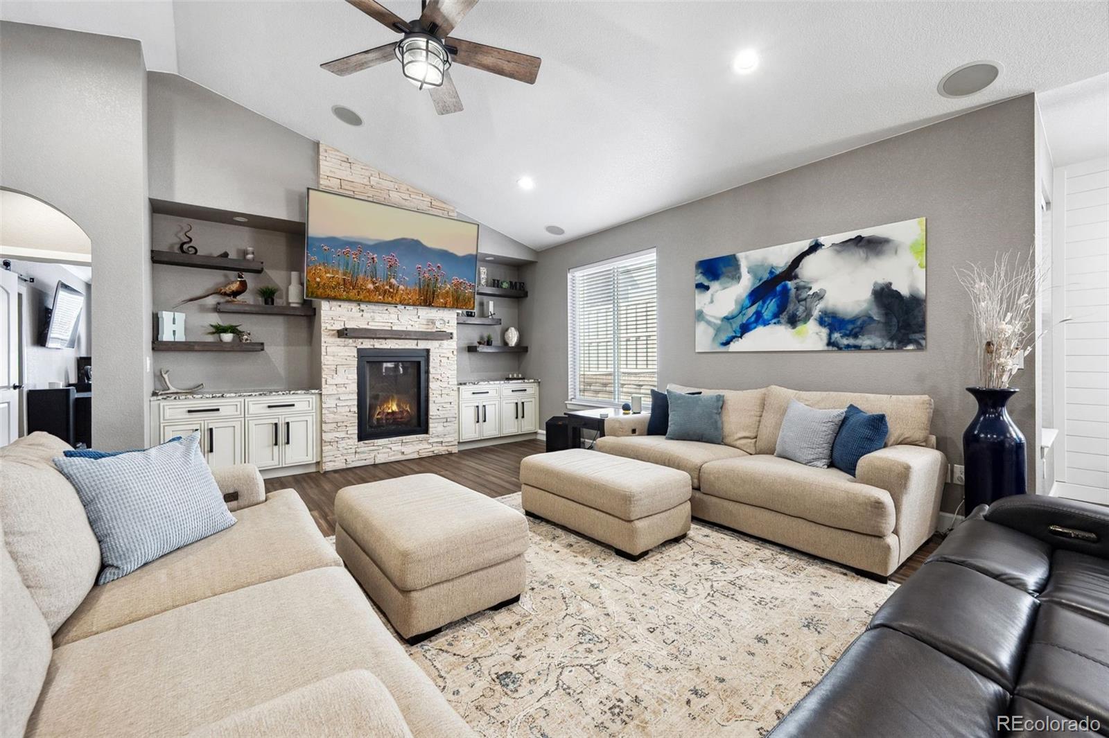 156 Chapel Hill Circle Brighton, CO 80601 - Photo 23 of 48 a living room with furniture and a fireplace