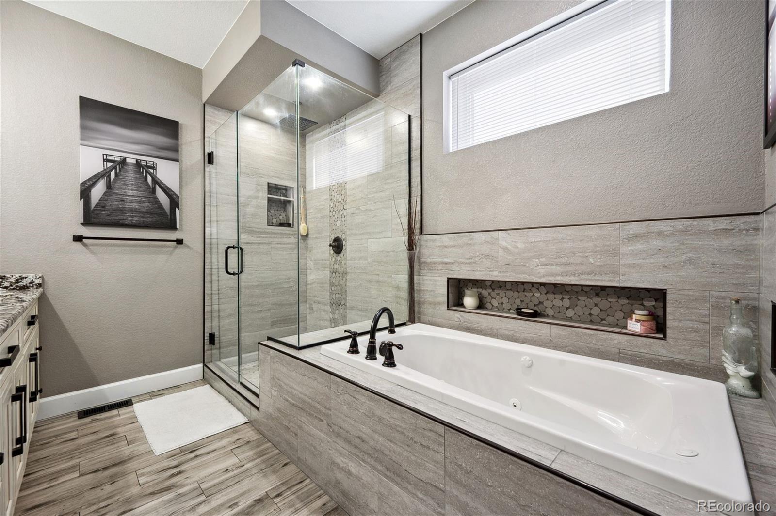 156 Chapel Hill Circle Brighton, CO 80601 - Photo 27 of 48 a bathroom with a bathtub and shower