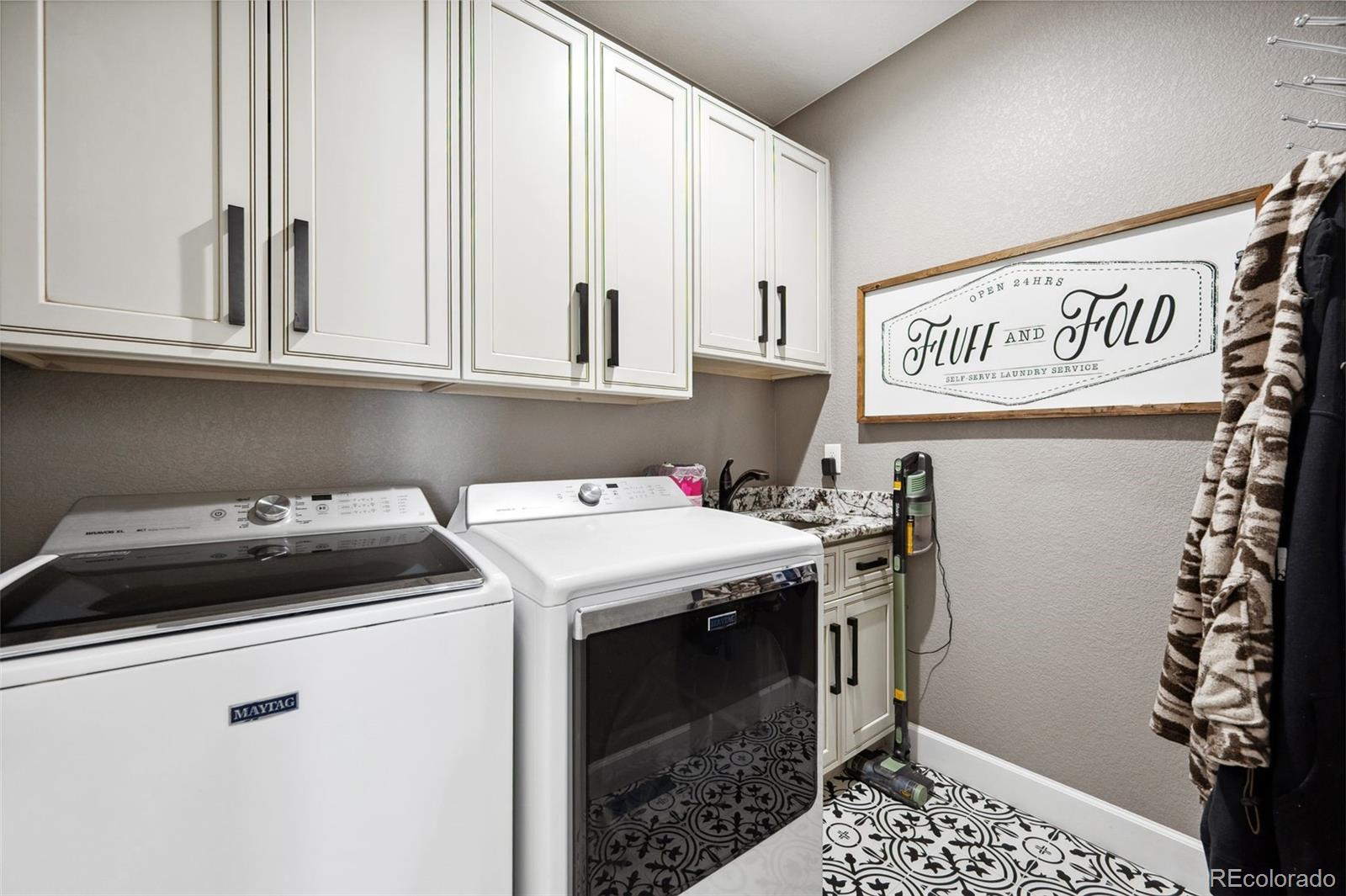156 Chapel Hill Circle Brighton, CO 80601 - Photo 29 of 48 a utility room with dryer and washer