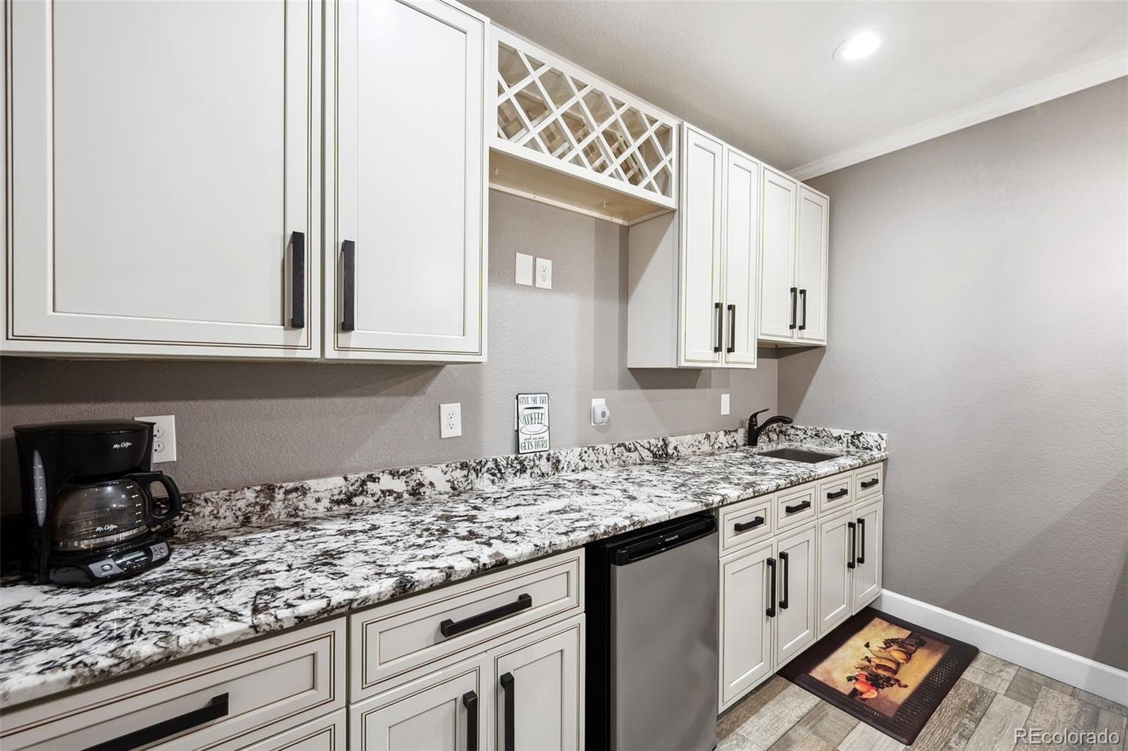 156 Chapel Hill Circle Brighton, CO 80601 - Photo 32 of 48 a kitchen with stainless steel appliances granite countertop a sink stove and cabinets