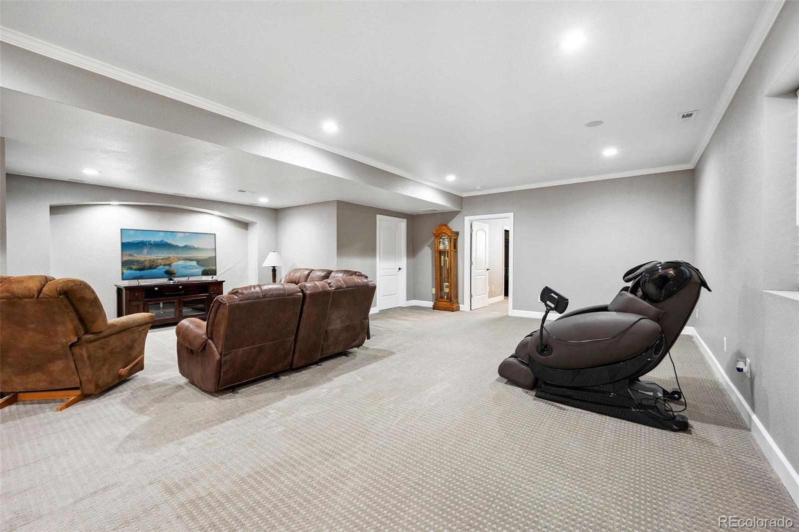 156 Chapel Hill Circle Brighton, CO 80601 - Photo 33 of 48 a living room with furniture a couch and a dresser