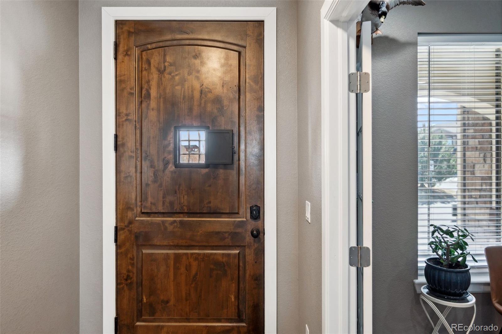 156 Chapel Hill Circle Brighton, CO 80601 - Photo 5 of 48 a view of a hallway with wooden floor