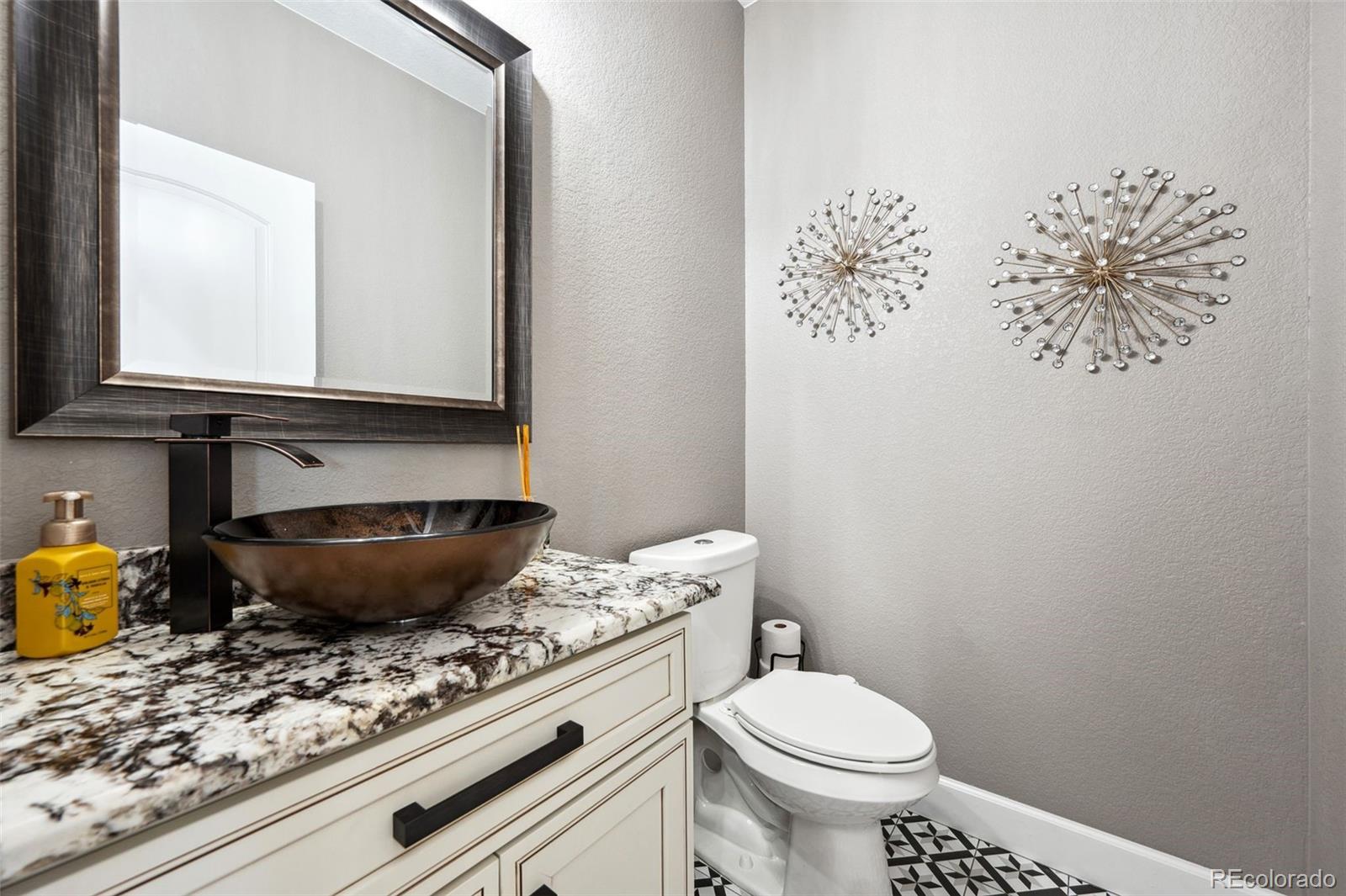 156 Chapel Hill Circle Brighton, CO 80601 - Photo 9 of 48 a bathroom with a granite countertop toilet and a sink