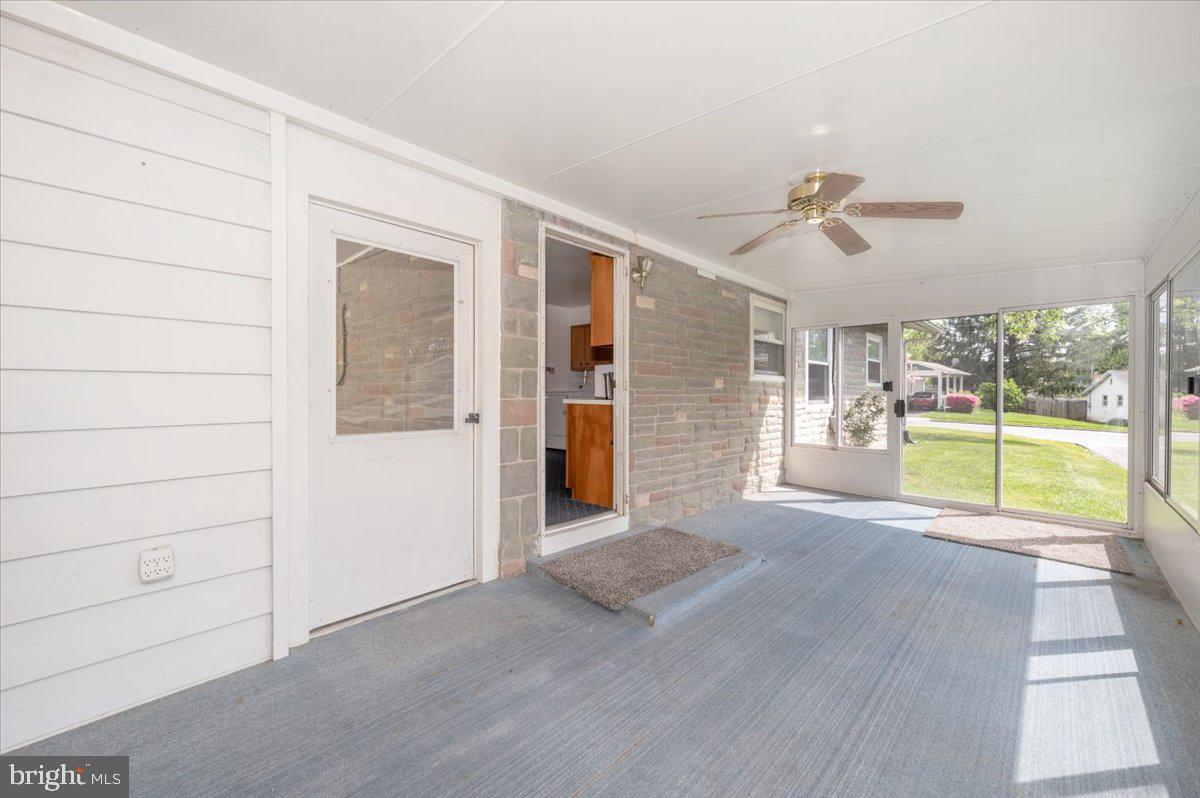 207 Barbara Street Frederick, MD 21701 - Photo 19 of 46 a view of a livingroom with wooden floor and a ceiling fan