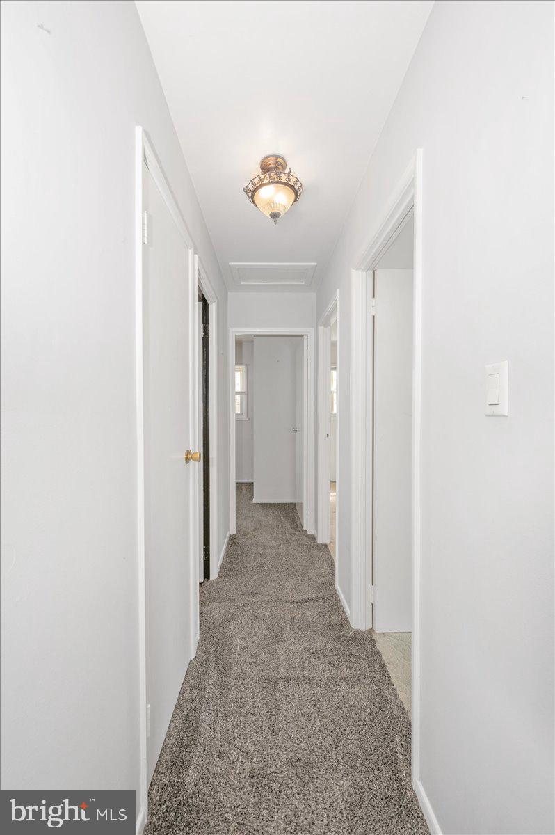 207 Barbara Street Frederick, MD 21701 - Photo 21 of 46 a view of a hallway with a chandelier