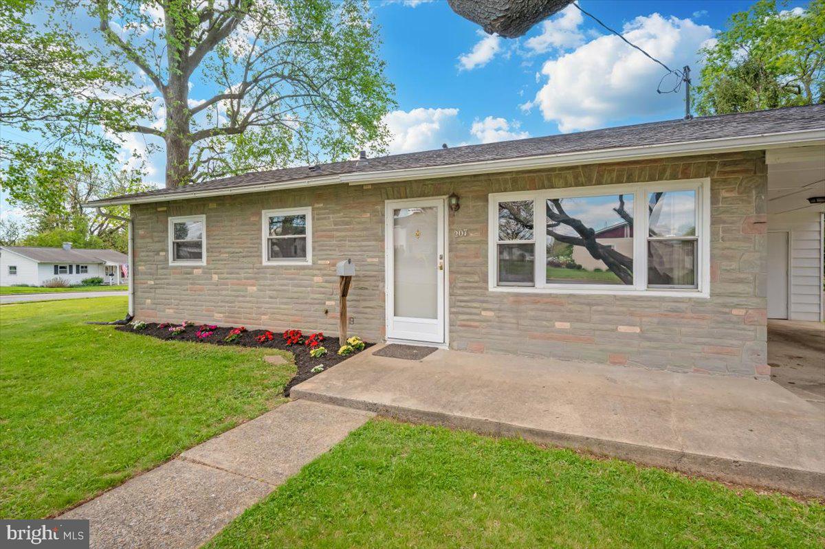 207 Barbara Street Frederick, MD 21701 - Photo 3 of 46 a front view of a house with a garden