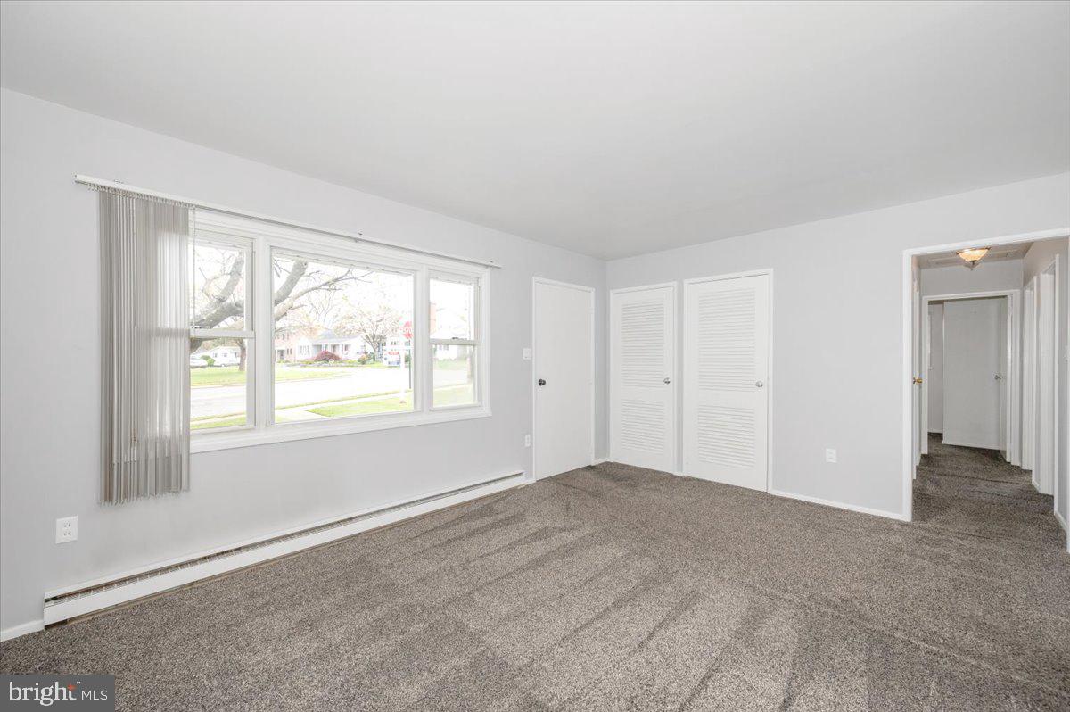 207 Barbara Street Frederick, MD 21701 - Photo 4 of 46 an empty room with windows and closet