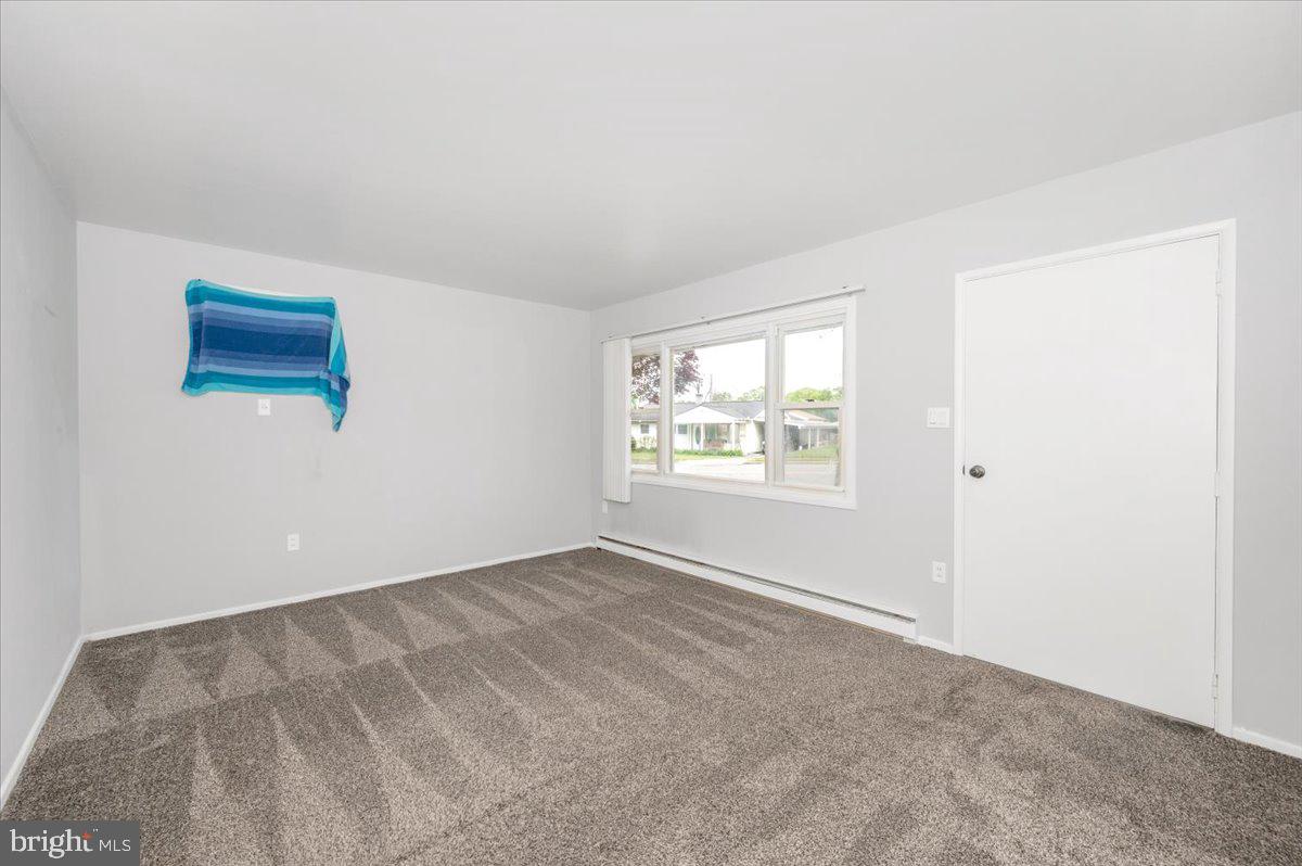 207 Barbara Street Frederick, MD 21701 - Photo 5 of 46 an empty room with windows