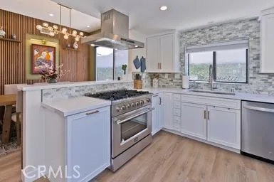 a kitchen with a stove oven and sink