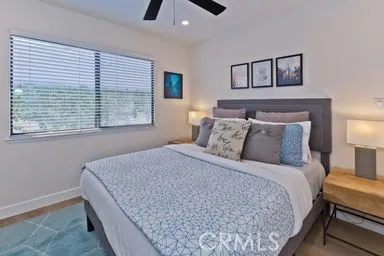 a bedroom with bed and window