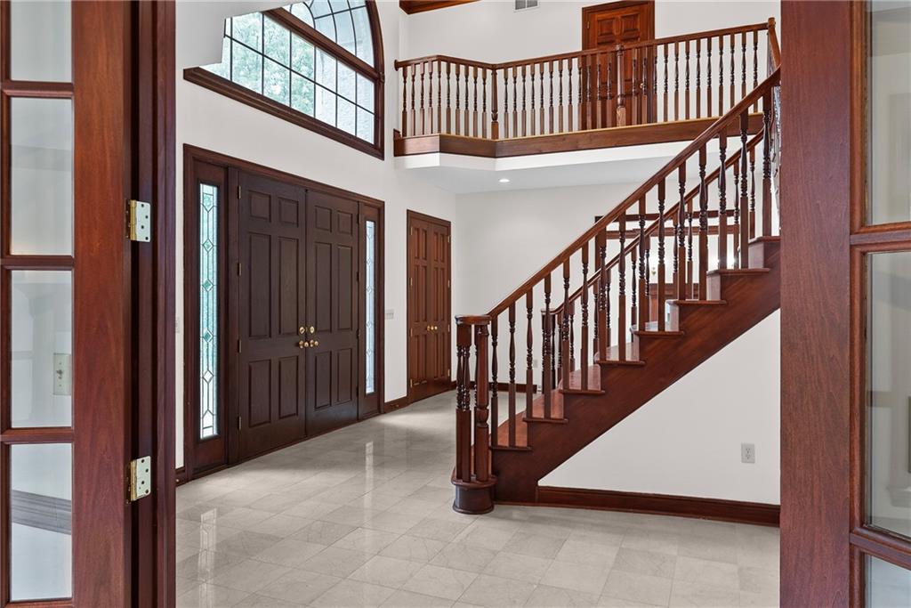 1060 Fox Chapel Road Pittsburgh, PA 15238 - Photo 12 of 50 Grand two-story foyer with sweeping split staircase and open second-floor overlook
