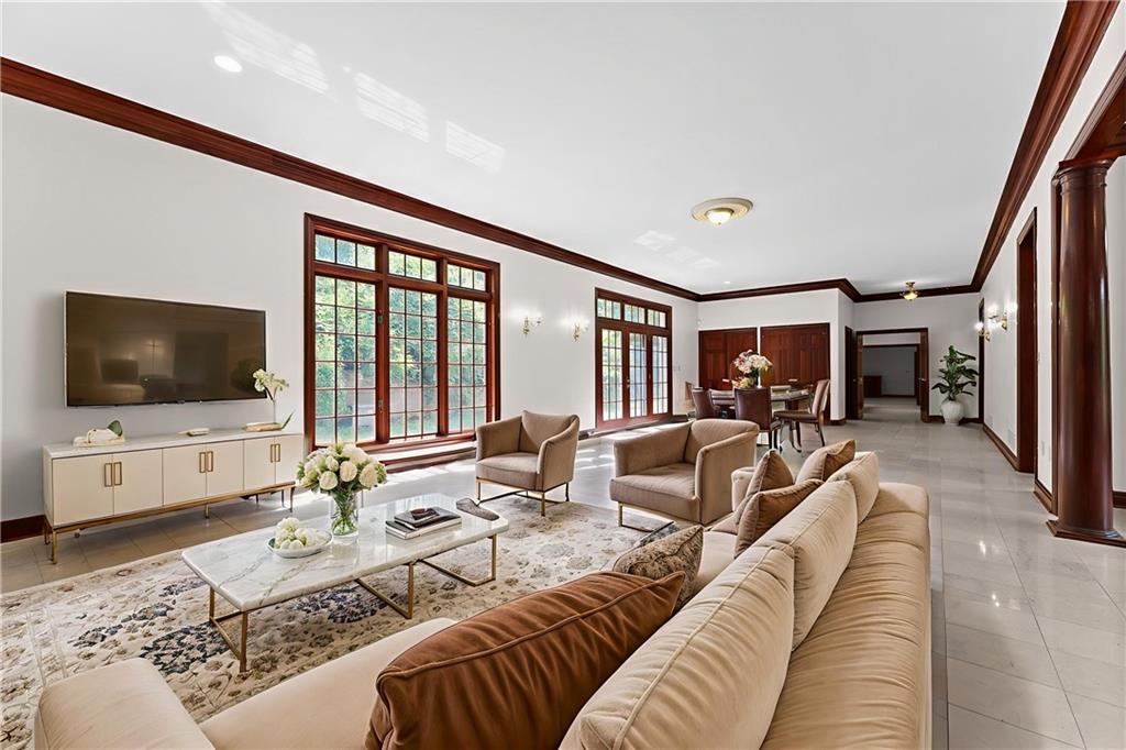 1060 Fox Chapel Road Pittsburgh, PA 15238 - Photo 14 of 50 Expansive family room with marble flooring, plenty of space for multiple living areas and a rough-in for a future wet bar