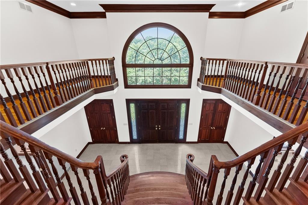 1060 Fox Chapel Road Pittsburgh, PA 15238 - Photo 8 of 50 Grand two-story foyer with sweeping split staircase and open second-floor overlook