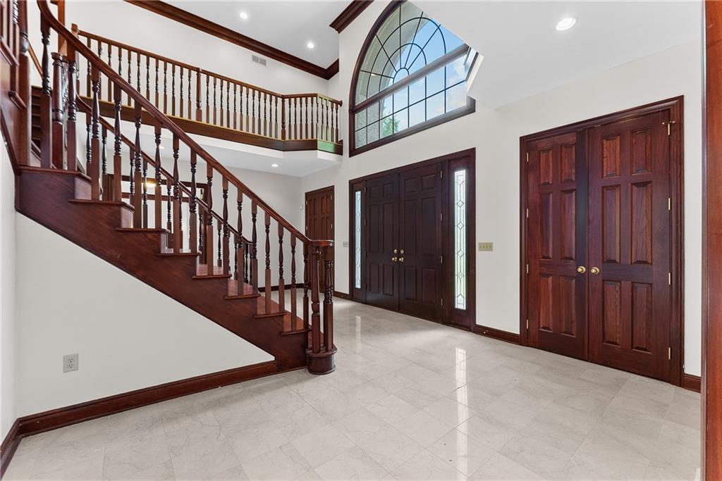 1060 Fox Chapel Road Pittsburgh, PA 15238 - Photo 9 of 50 Grand two-story foyer with sweeping split staircase and open second-floor overlook