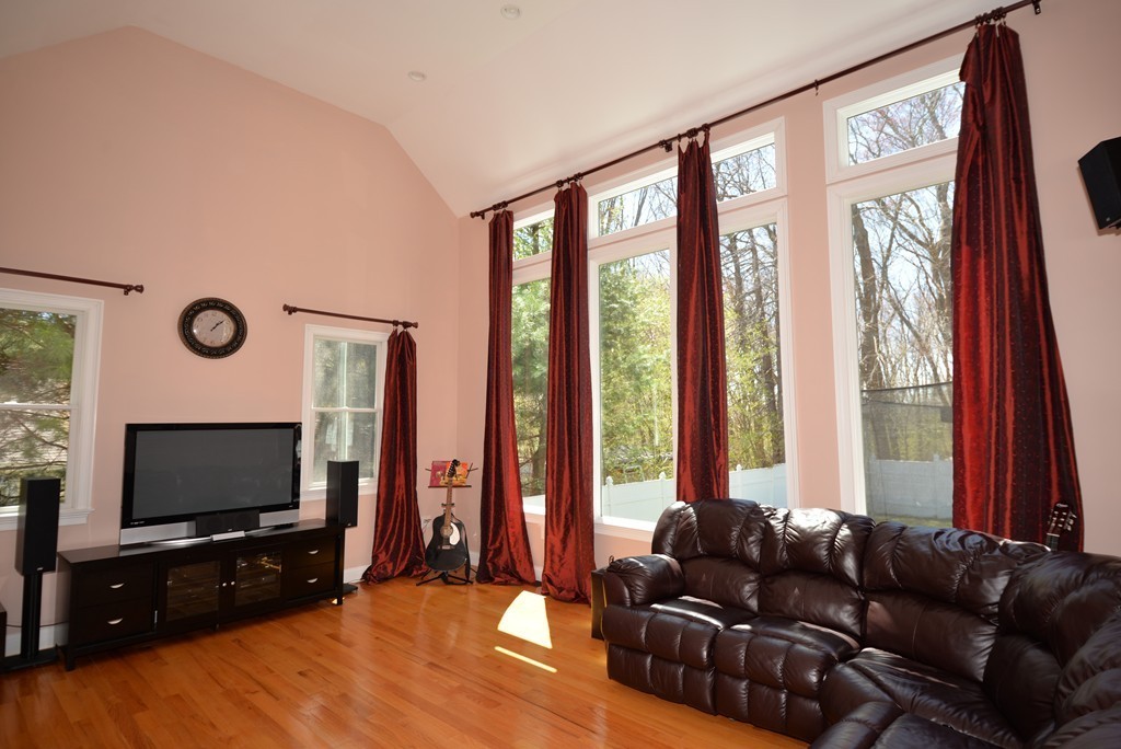 16 Walsh Road Newton, MA 02459 - Photo 3 of 21 a living room with furniture a flat screen tv and a large window