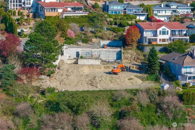 an aerial view of residential houses and car parked on street side
