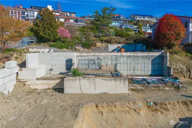 a view of roof deck with dining table and chairs