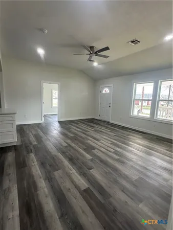 a kitchen with a sink cabinets and window