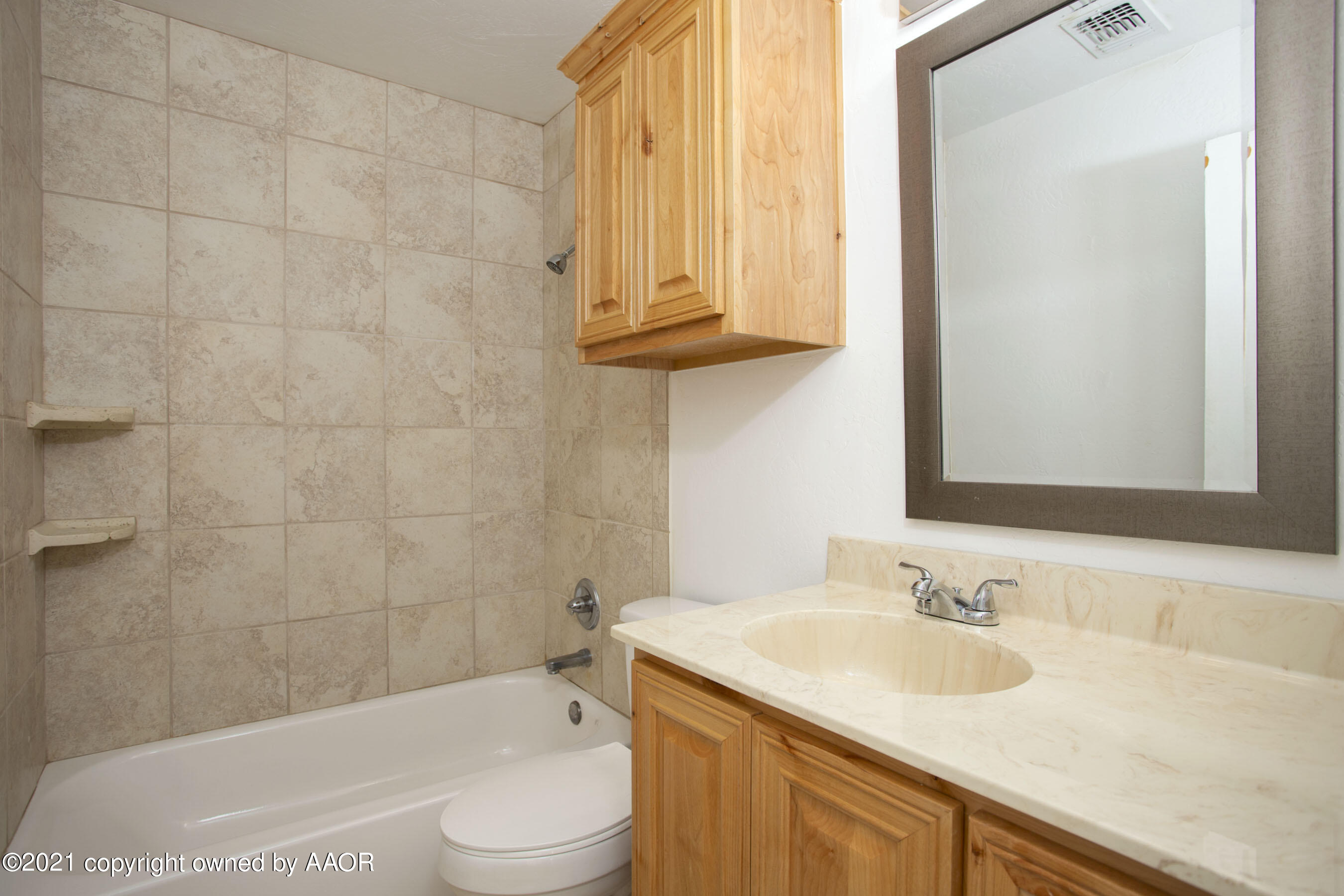4312 South Monroe Street Amarillo, TX 79110 - Photo 11 of 18 a bathroom with a sink toilet and shower