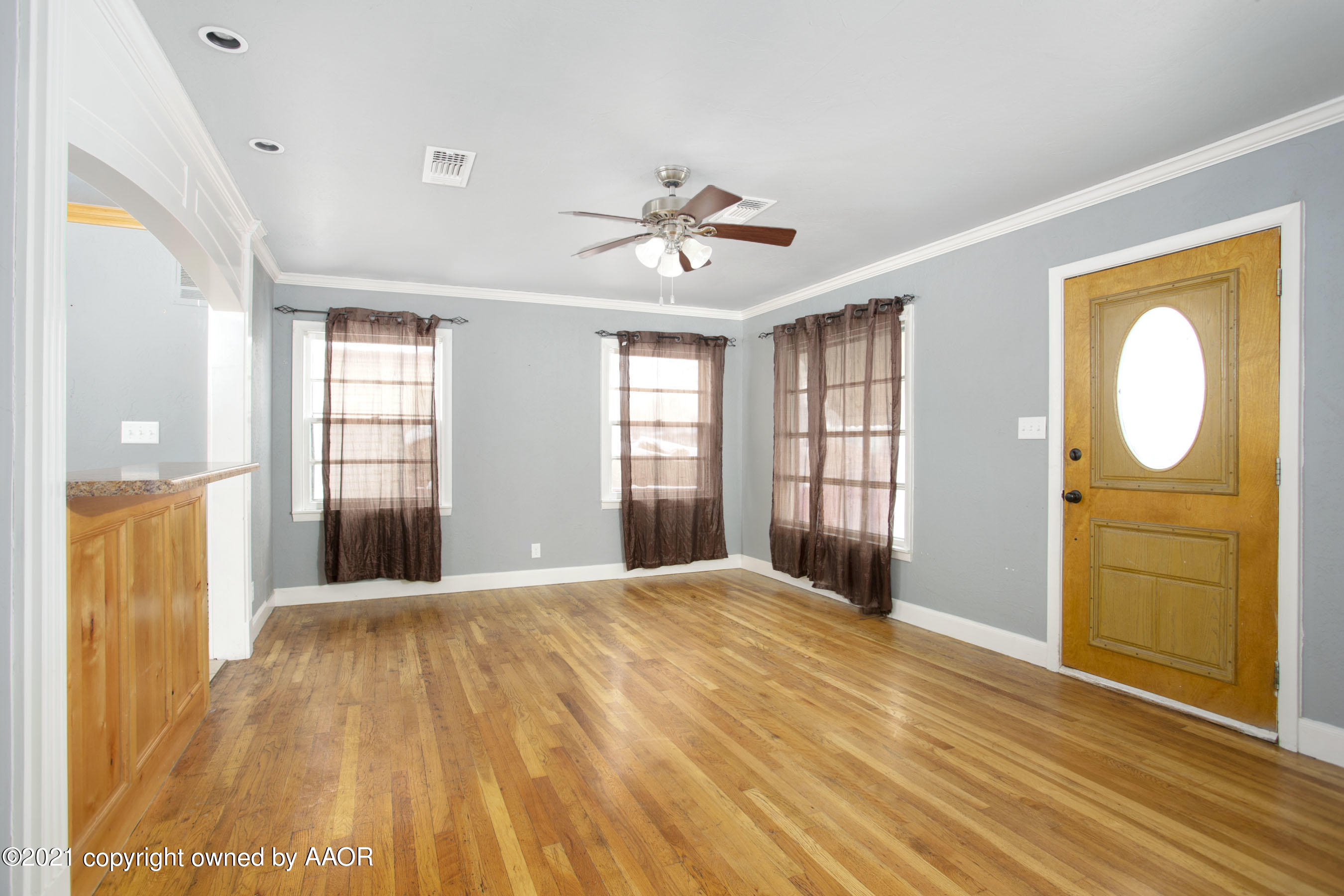 4312 South Monroe Street Amarillo, TX 79110 - Photo 3 of 18 a view of an empty room with a window and bathroom