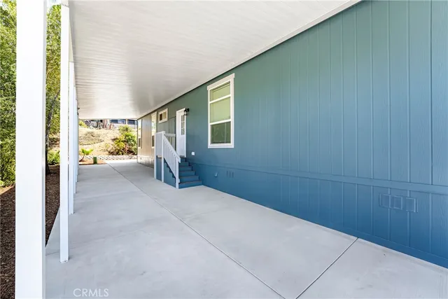 a view of an empty room and a window