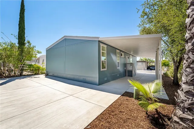 a view of a chair and tables in the patio