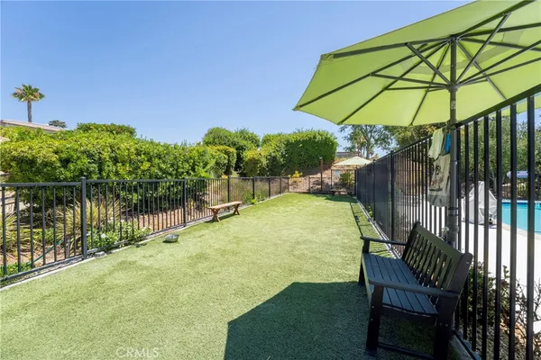 a view of a swimming pool with a patio