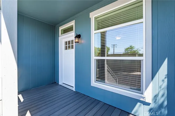a view of a house that has wooden floor and a window