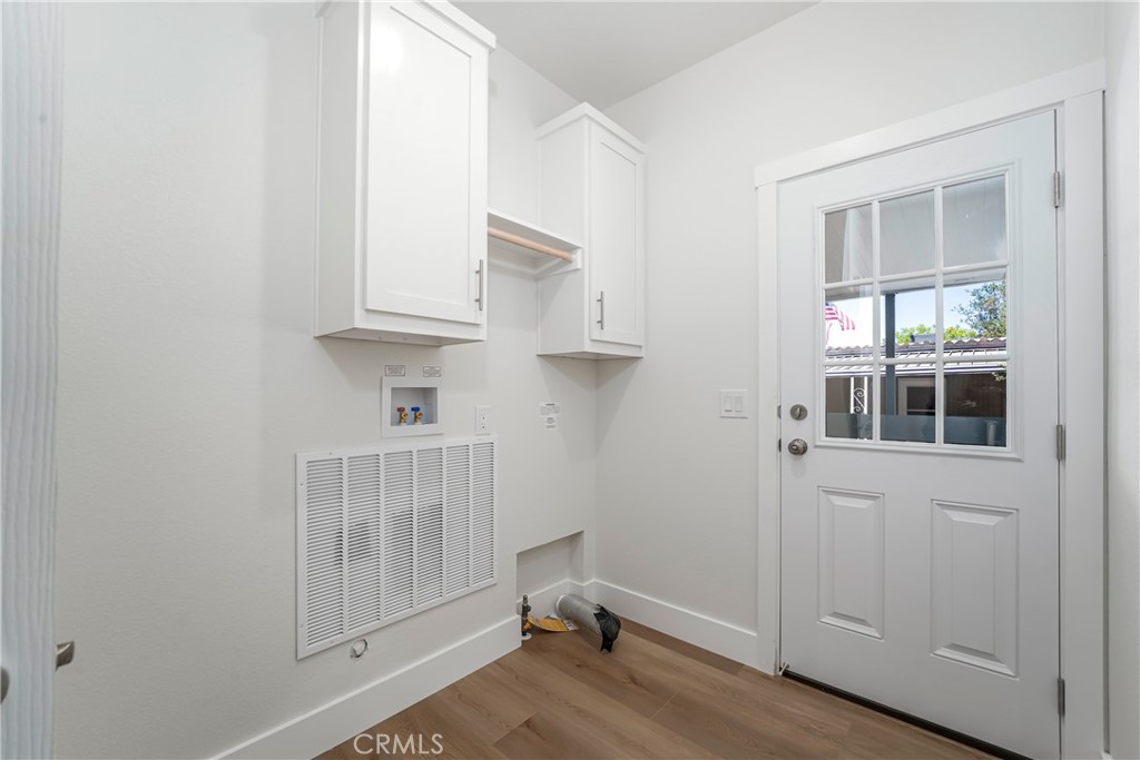 1120 East Mission Road, Unit 57 Fallbrook, CA 92028 - Photo 9 of 25 a view of kitchen and wooden floor