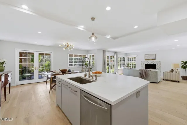 a kitchen with sink and refrigerator