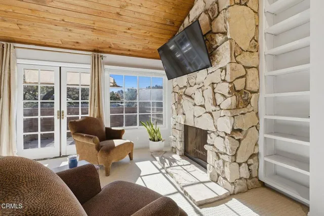 a spacious bedroom with a bed and a large window