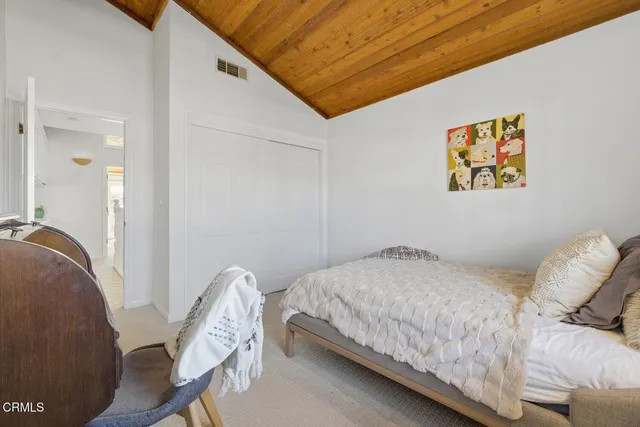 a bathroom with a tub a sink and mirrors