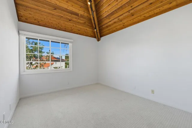 a bathroom with a sink vanity mirror and toilet