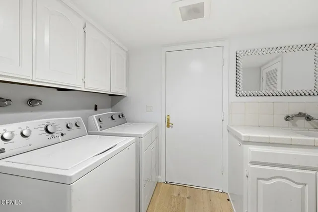 a view of cabinets and utility room