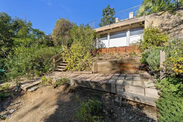 an aerial view of a house with a garden