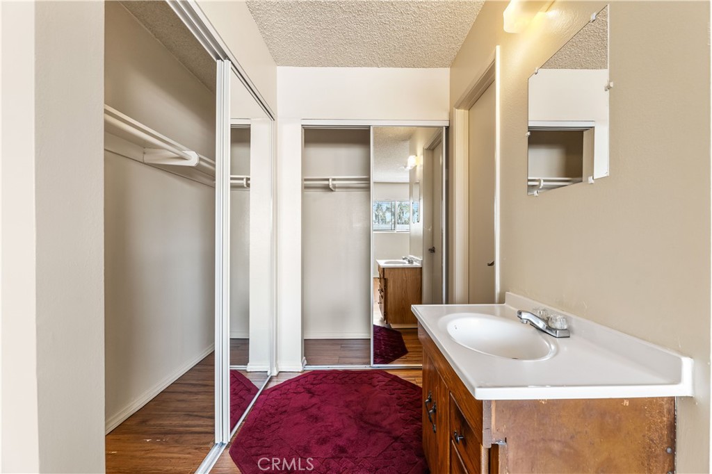5530 Ackerfield Avenue, Unit 206 Long Beach, CA 90805 - Photo 16 of 33 a en suite bathroom with a sink and a mirror