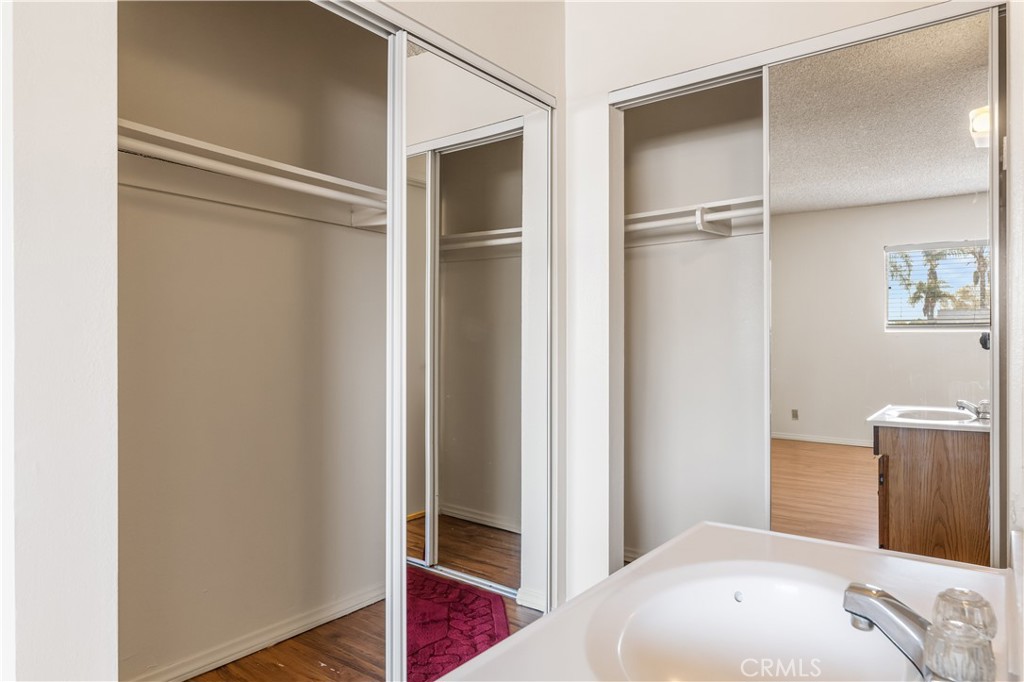 5530 Ackerfield Avenue, Unit 206 Long Beach, CA 90805 - Photo 17 of 33 a bedroom with a bed and a wardrobe