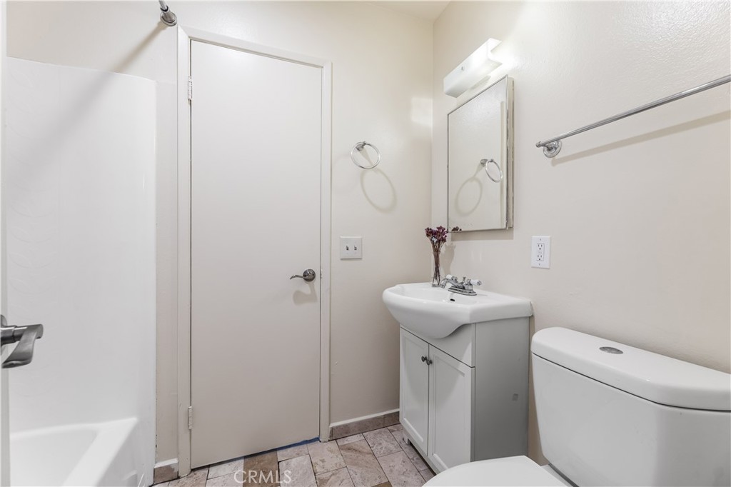 5530 Ackerfield Avenue, Unit 206 Long Beach, CA 90805 - Photo 23 of 33 a bathroom with a sink toilet and shower