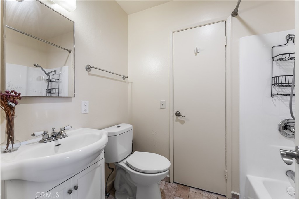 5530 Ackerfield Avenue, Unit 206 Long Beach, CA 90805 - Photo 24 of 33 a bathroom with a sink toilet and shower