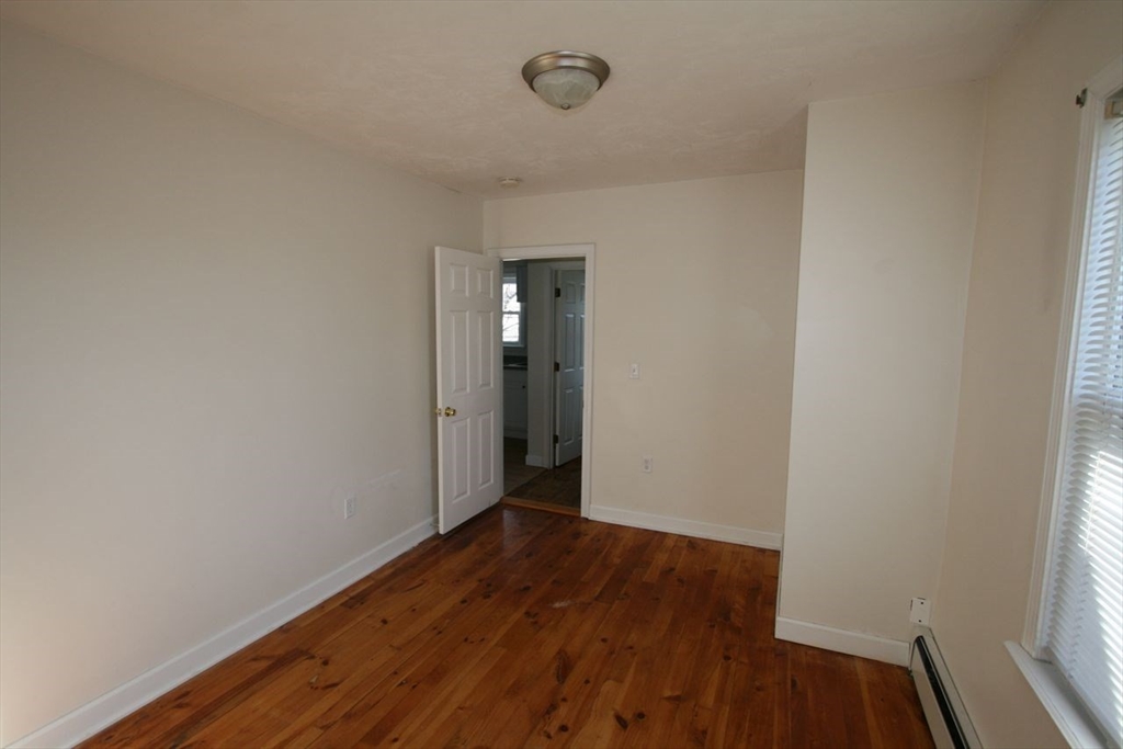 31 Goddard Street Webster, MA 01570 - Photo 15 of 31 a view of an empty room with wooden floor and a window