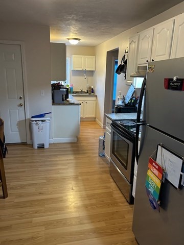 31 Goddard Street Webster, MA 01570 - Photo 20 of 31 a kitchen with stainless steel appliances a stove a refrigerator and cabinets