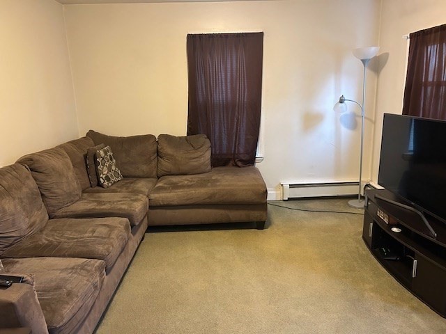 31 Goddard Street Webster, MA 01570 - Photo 7 of 31 a living room with furniture and a flat screen tv