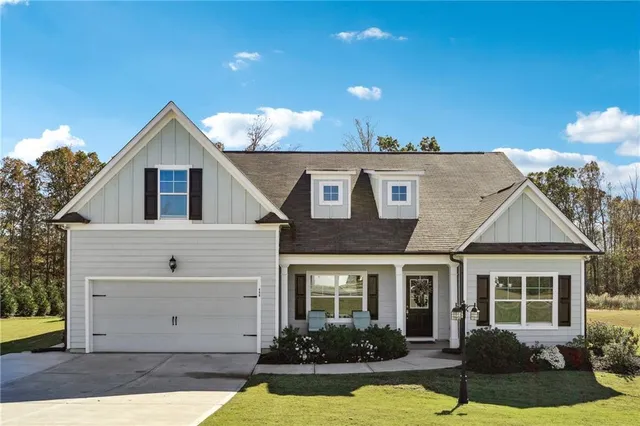 a view of a house with swimming pool in front of it