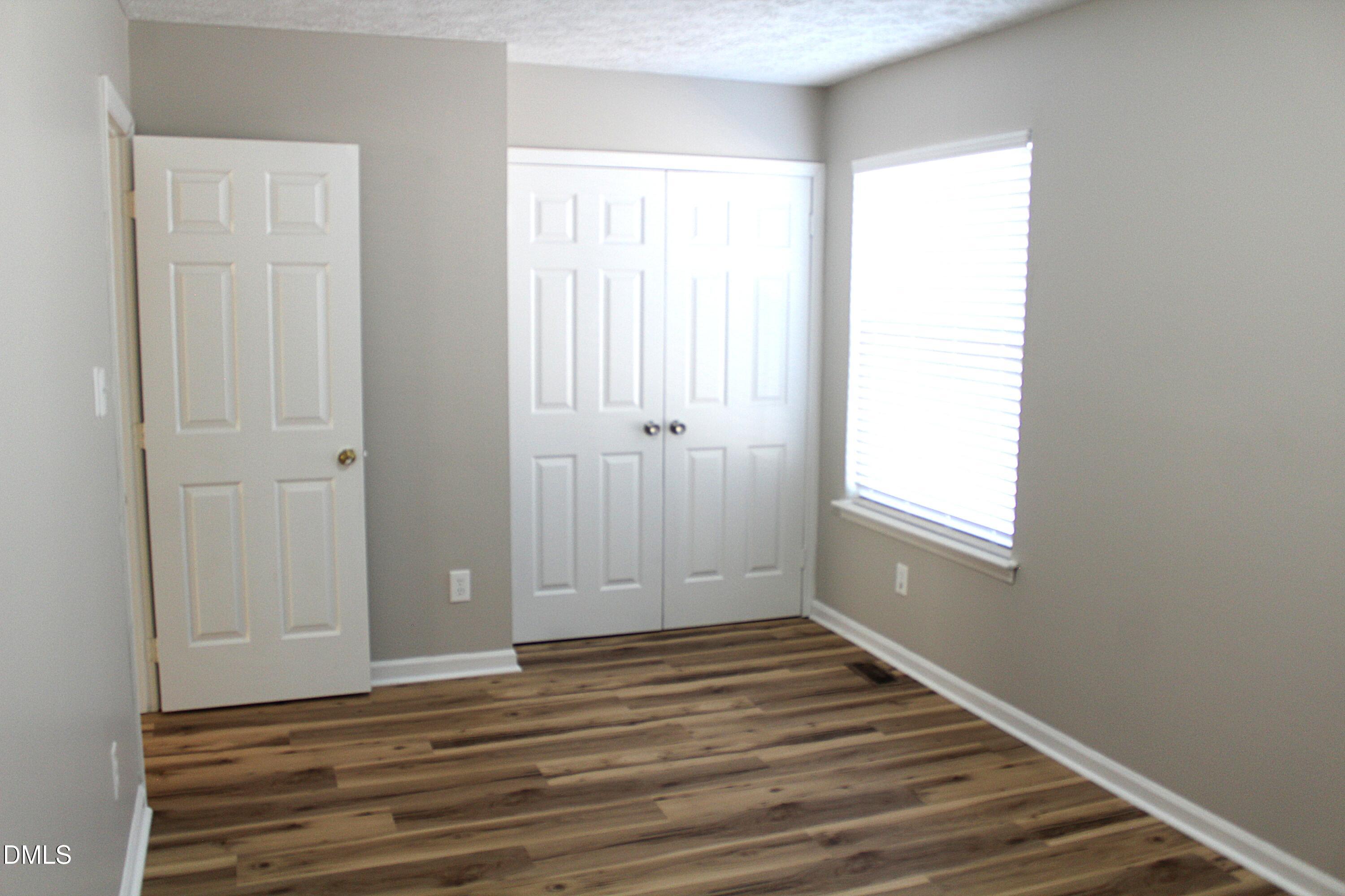 2706 Big Oak Street Raleigh, NC 27610 - Photo 2 of 11 a view of a livingroom with wooden floor and window