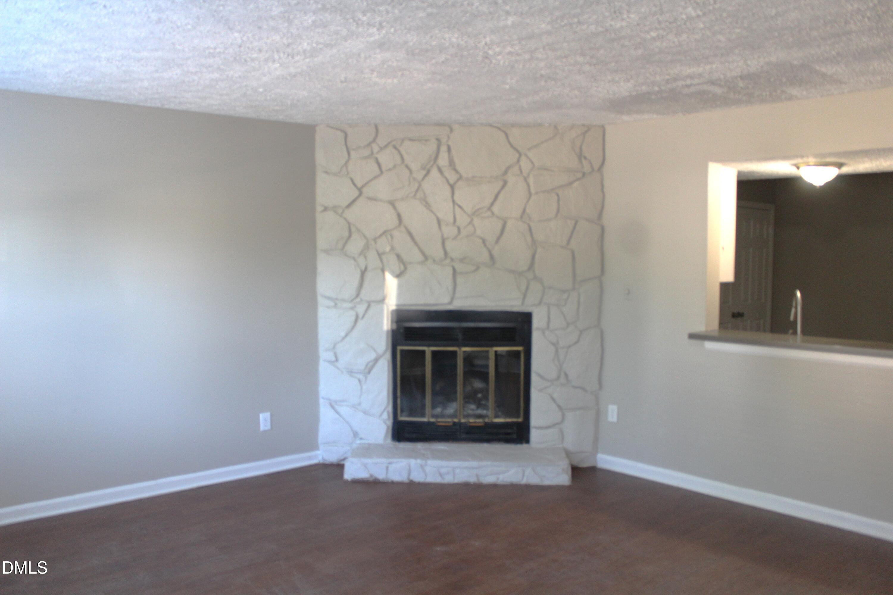 2706 Big Oak Street Raleigh, NC 27610 - Photo 4 of 11 a view of empty room with a fireplace