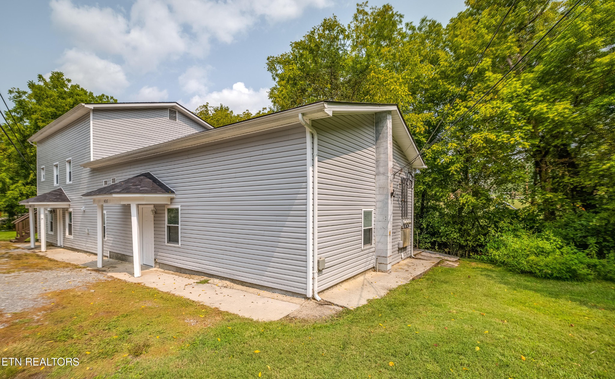 4707 Wildwood Road Maryville, TN 37804 - Photo 18 of 18 a view of a house with a yard