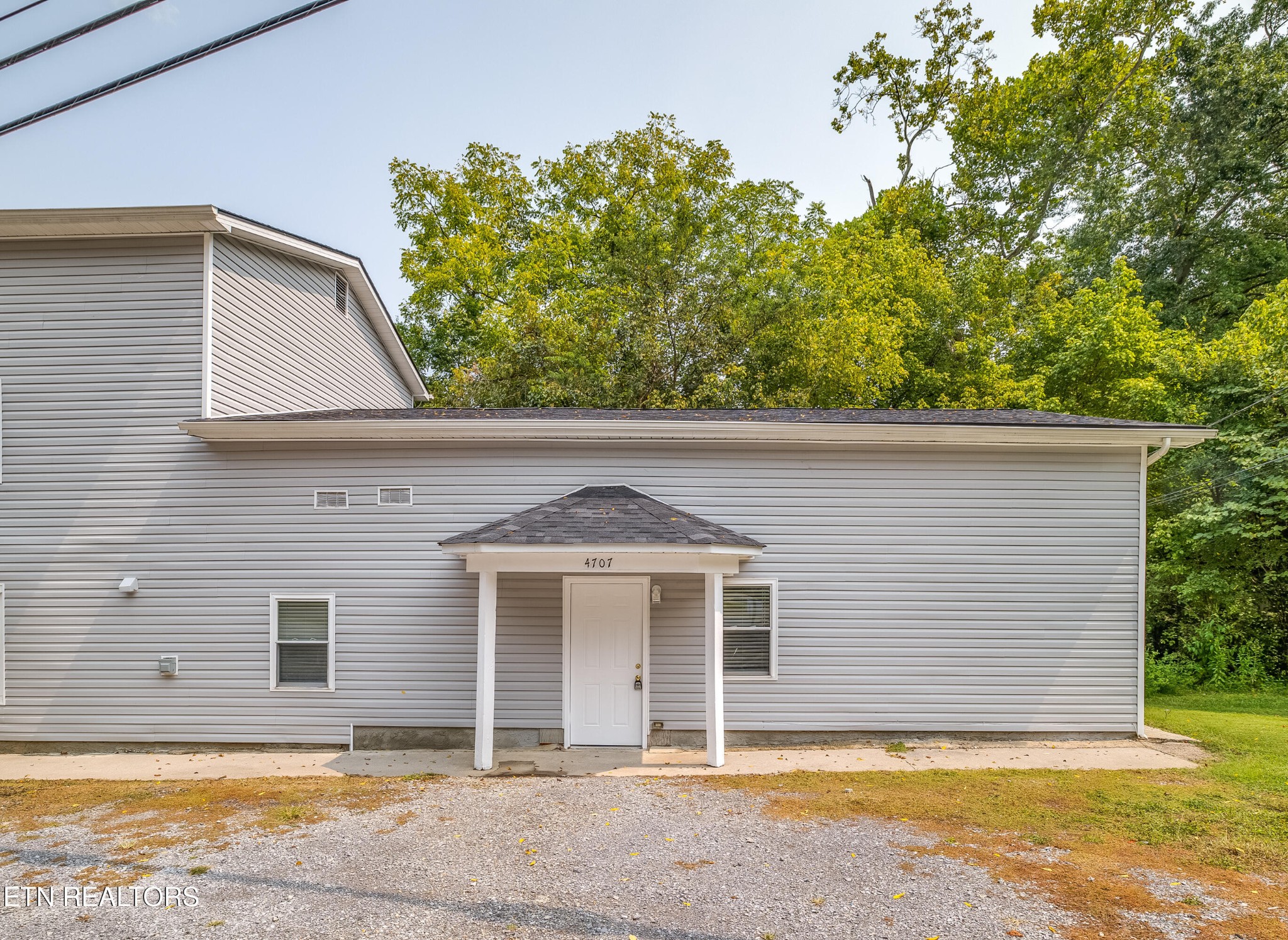 4707 Wildwood Road Maryville, TN 37804 - Photo 2 of 18 a view of a house with a backyard
